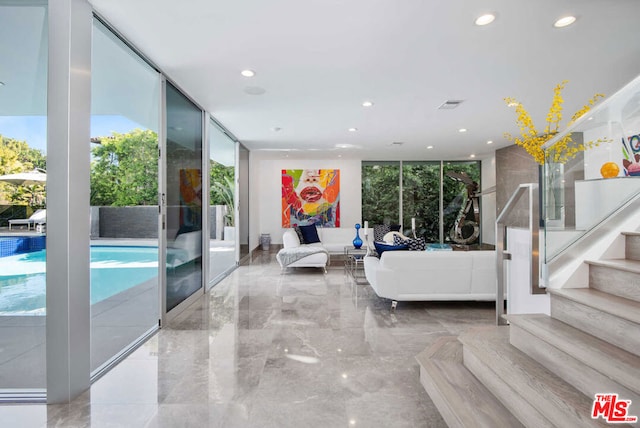 living room with floor to ceiling windows