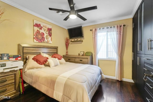 bedroom featuring dark wood-type flooring, ceiling fan, and crown molding