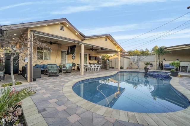 view of pool featuring an outdoor hangout area, a patio, ceiling fan, and an in ground hot tub