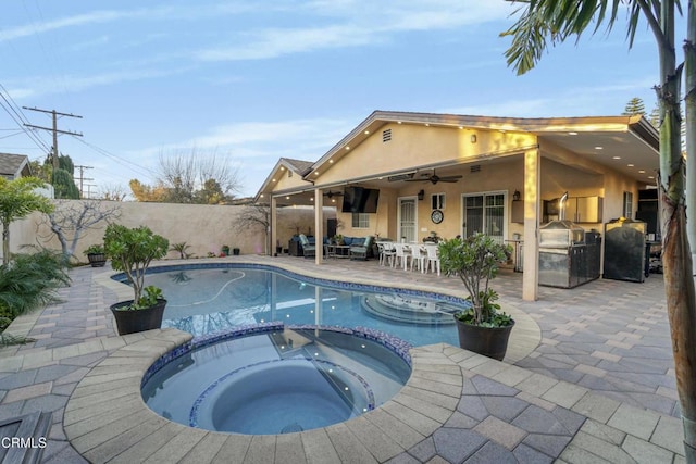 view of swimming pool with ceiling fan, a patio area, area for grilling, and an in ground hot tub