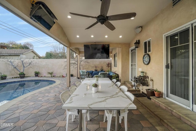 view of patio / terrace with a fenced in pool and outdoor lounge area