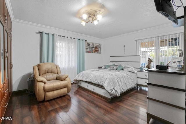 bedroom with a textured ceiling, ornamental molding, and dark hardwood / wood-style floors