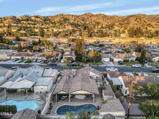 birds eye view of property featuring a mountain view