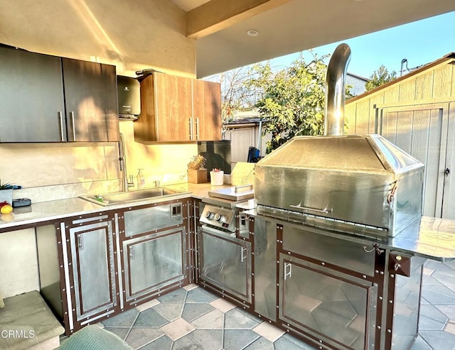 view of patio / terrace with sink and area for grilling