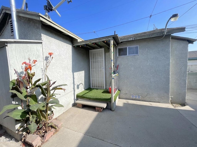 entrance to property with a patio area