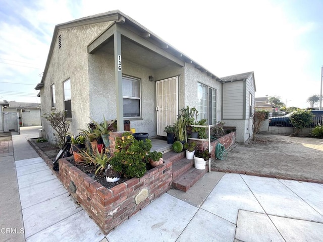 view of front facade with a porch and a patio