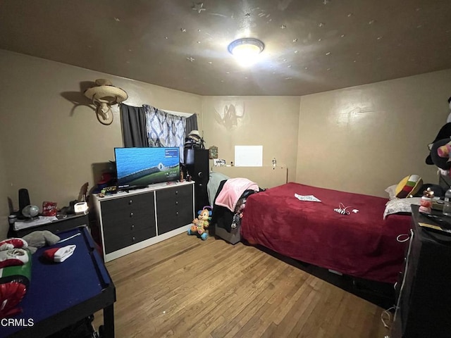 bedroom featuring hardwood / wood-style floors