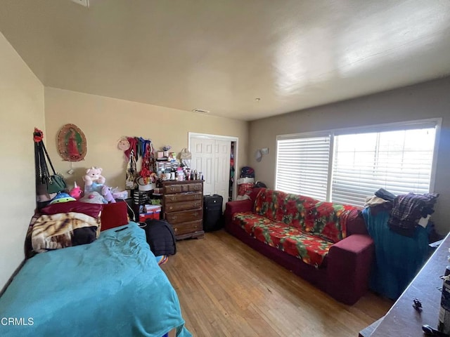 bedroom featuring a closet and light hardwood / wood-style floors