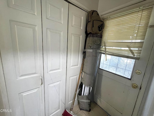 doorway to outside featuring light tile patterned floors