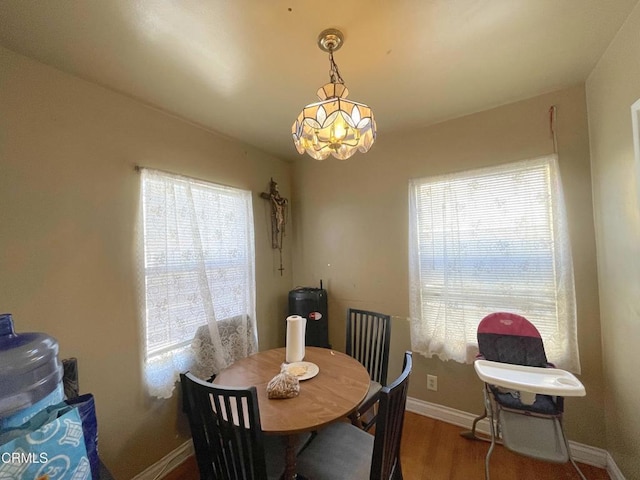 136 S Roosevelt Ave, Oxnard, CA 93030 - dining space featuring plenty of natural light, wood finished floors, and a chandelier
