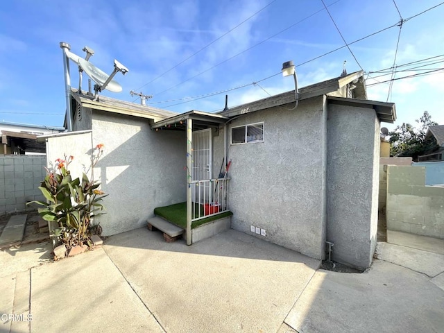 136 S Roosevelt Ave, Oxnard, CA 93030 - rear view of property featuring stucco siding, a patio, and crawl space