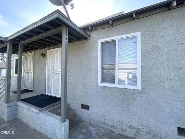 136 S Roosevelt Ave, Oxnard, CA 93030 - doorway to property featuring crawl space and stucco siding