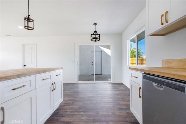 kitchen with dark wood-type flooring, dishwasher, white cabinets, and hanging light fixtures