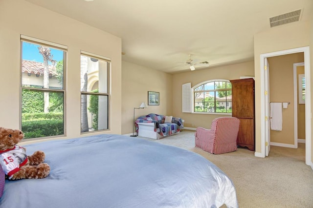 carpeted bedroom with ceiling fan