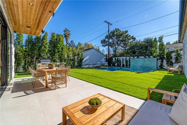 view of patio with a swimming pool