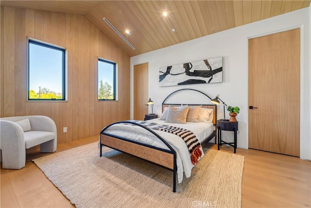 bedroom featuring lofted ceiling, wood ceiling, wooden walls, and hardwood / wood-style flooring