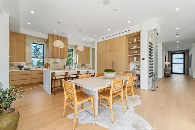 dining space with light wood-type flooring