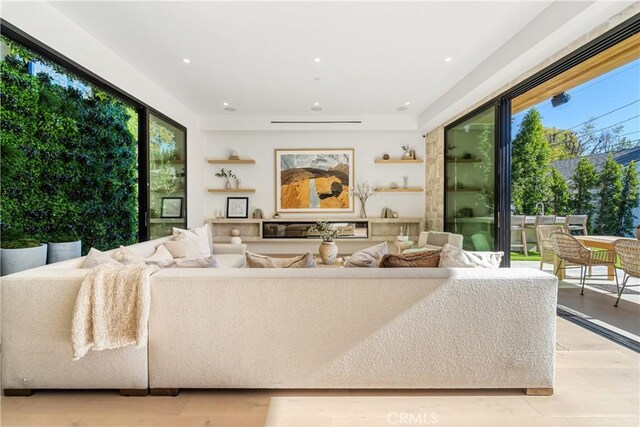 living room with light hardwood / wood-style floors