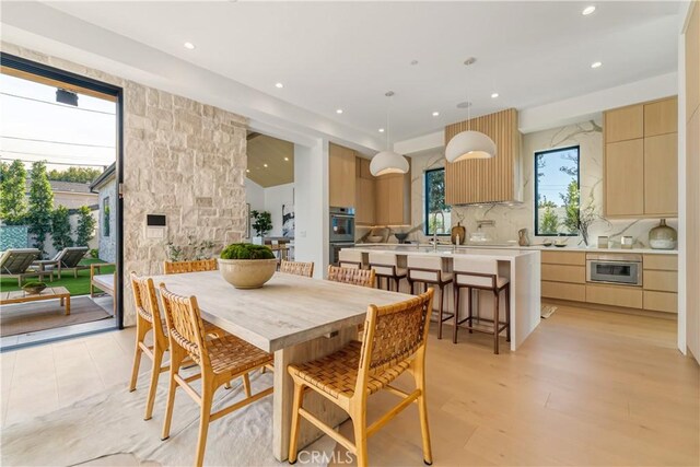 dining room with light wood-type flooring