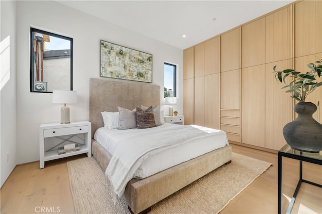 bedroom with light hardwood / wood-style floors