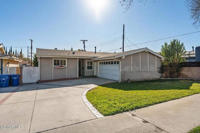 ranch-style house featuring a garage and a front lawn