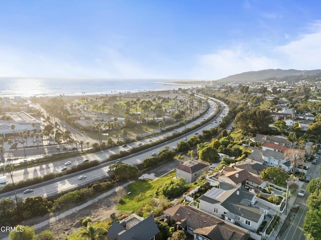 aerial view featuring a water view and a beach view