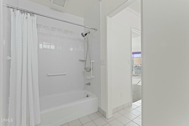 bathroom with tile patterned flooring and shower / bath combo with shower curtain