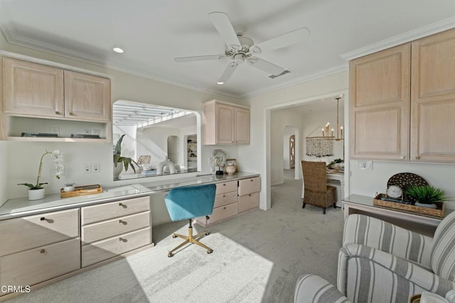 kitchen with crown molding, hanging light fixtures, light brown cabinets, light colored carpet, and ceiling fan with notable chandelier