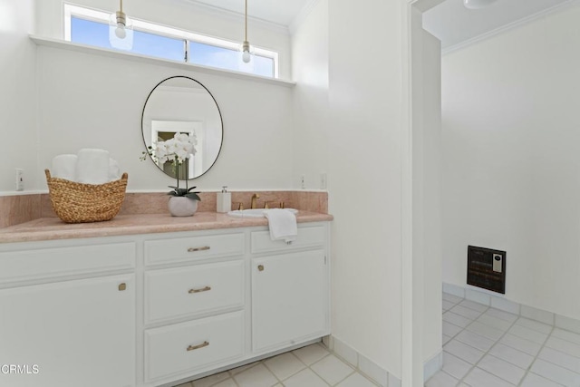 bathroom featuring crown molding, vanity, and tile patterned flooring