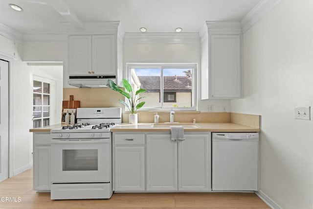 kitchen featuring white appliances, sink, and white cabinets