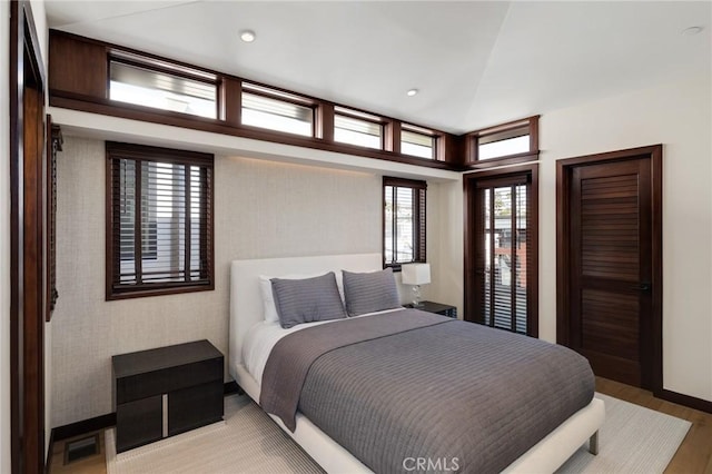 bedroom featuring light wood-type flooring and recessed lighting