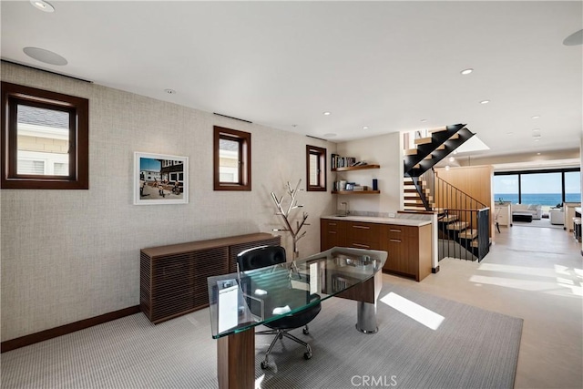 office with recessed lighting, light colored carpet, baseboards, and wallpapered walls