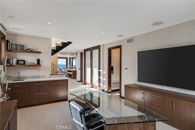 kitchen with modern cabinets, visible vents, a sink, and recessed lighting