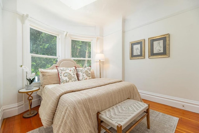 bedroom with hardwood / wood-style floors