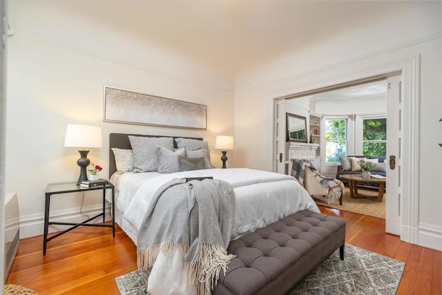 bedroom with hardwood / wood-style floors