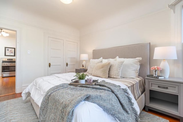 bedroom with hardwood / wood-style flooring