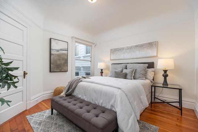 bedroom with hardwood / wood-style flooring