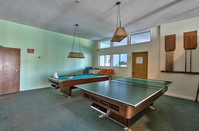 playroom featuring billiards, a high ceiling, a textured ceiling, and dark carpet