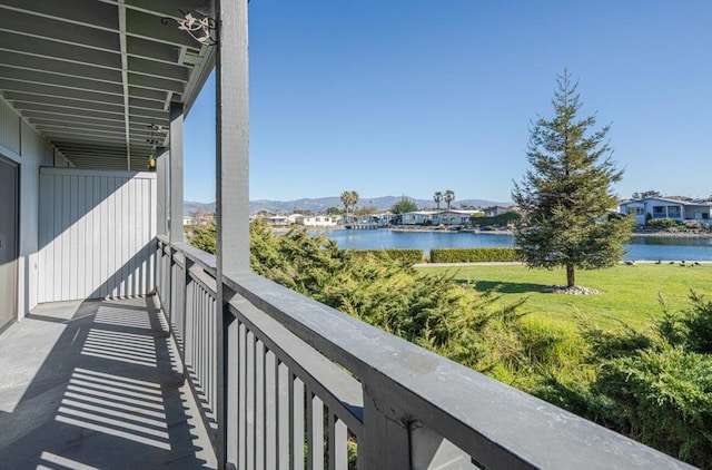 balcony featuring a water view