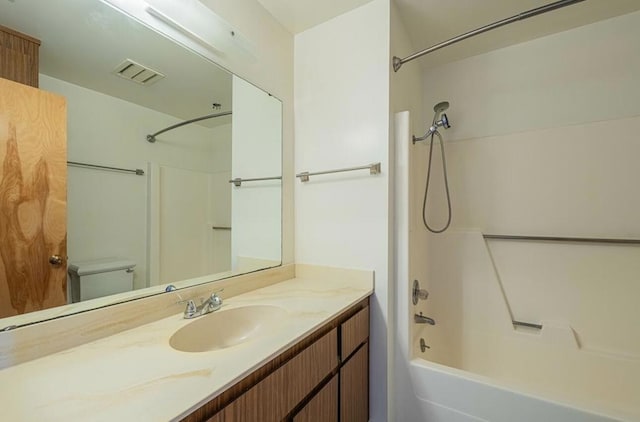 full bathroom featuring toilet,  shower combination, and vanity