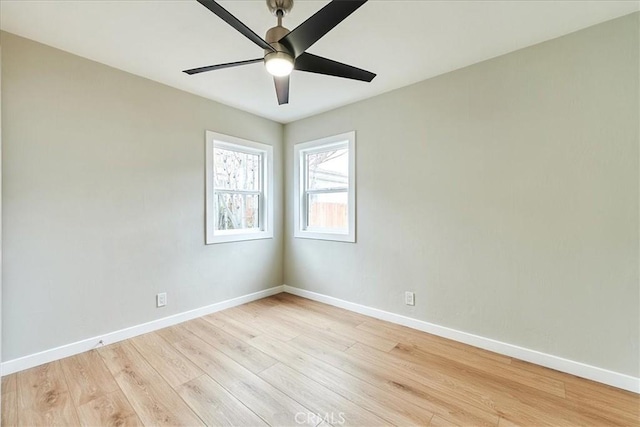 spare room featuring light hardwood / wood-style floors and ceiling fan