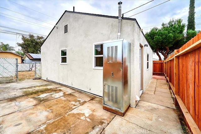 rear view of house featuring a patio area