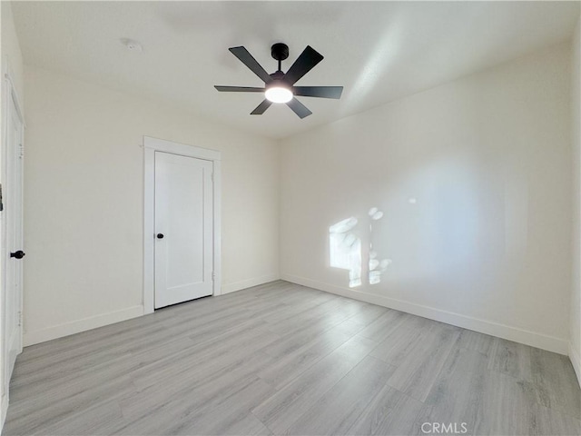 unfurnished bedroom with ceiling fan and light hardwood / wood-style floors