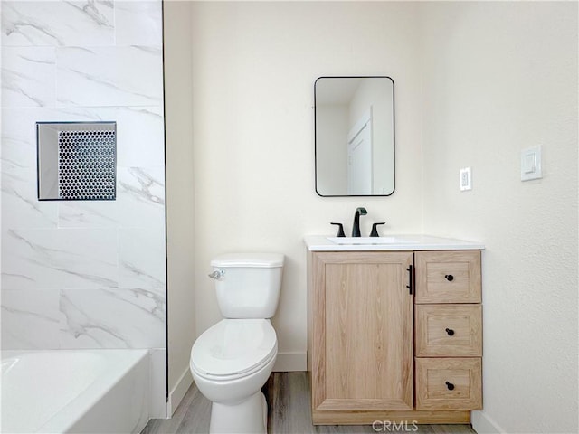 full bathroom with shower / bath combination, hardwood / wood-style floors, toilet, and vanity