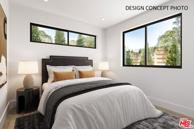 bedroom with multiple windows and wood-type flooring