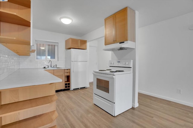 kitchen with sink, light brown cabinets, white appliances, and light wood-type flooring