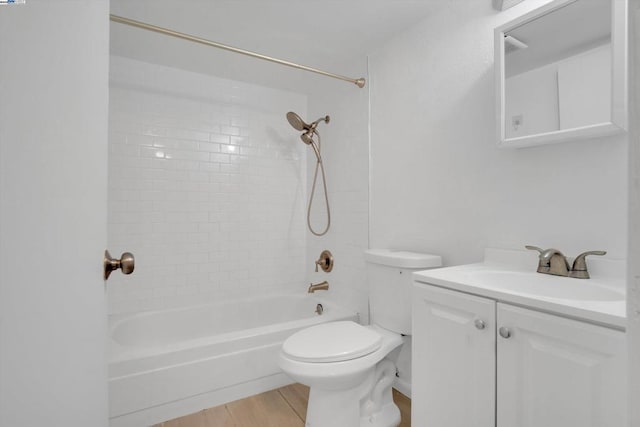 full bathroom with toilet, shower / washtub combination, wood-type flooring, and vanity