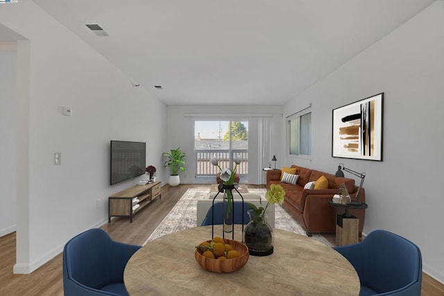 living room with light hardwood / wood-style floors