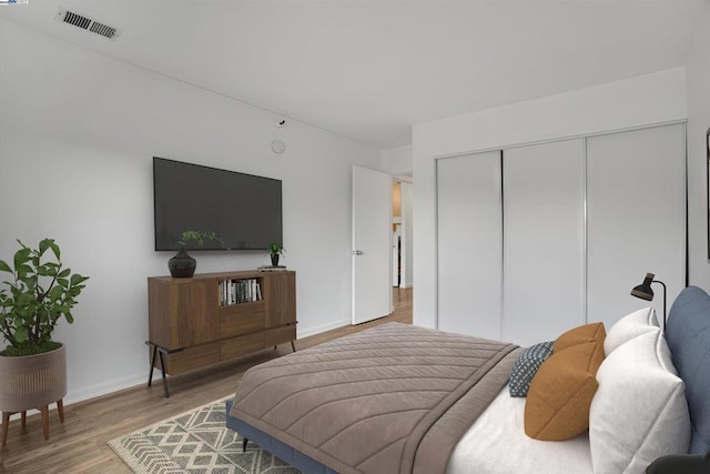 bedroom featuring a closet and wood-type flooring