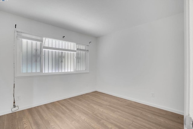 empty room with light wood-type flooring